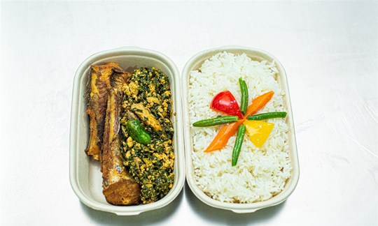 Rice served with Nkontomire Stew