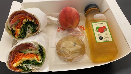 Executive Boxed Lunch 2A       (4 Items) Large Window Box - Gourmet Wrap, Individually wrapped biscuit, Fruit Portion, 250 ml Juice.