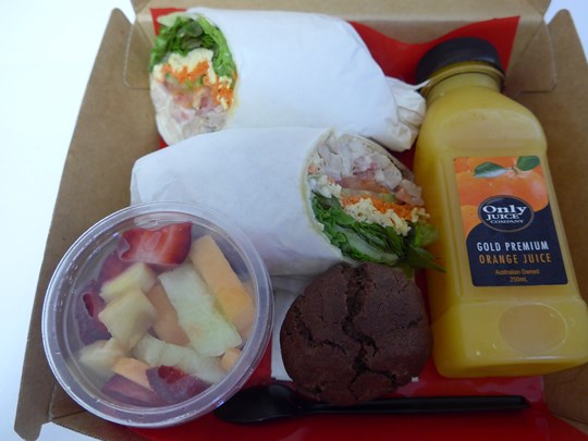 Executive Boxed Lunch 2      (4 Items) Large Window Box - Gourmet Wrap, Individually wrapped biscuit, Fruit Salad, 250 ml Juice.