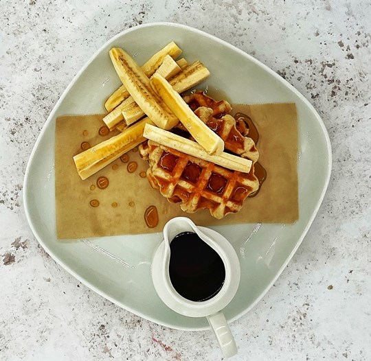 American Style Waffles served with Banana & Maple Syrup