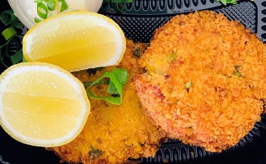 Salmon cakes with chive sour cream and Salad Greens