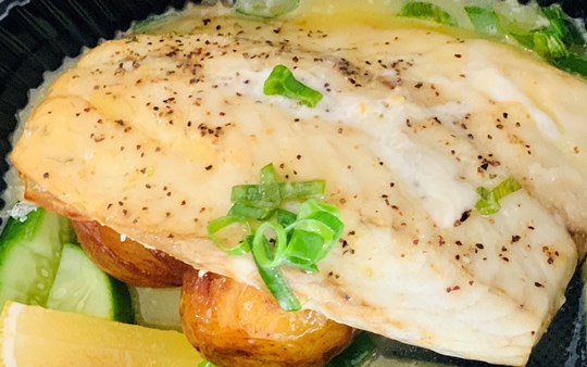 Lemon butter fish with garden salad and lemon